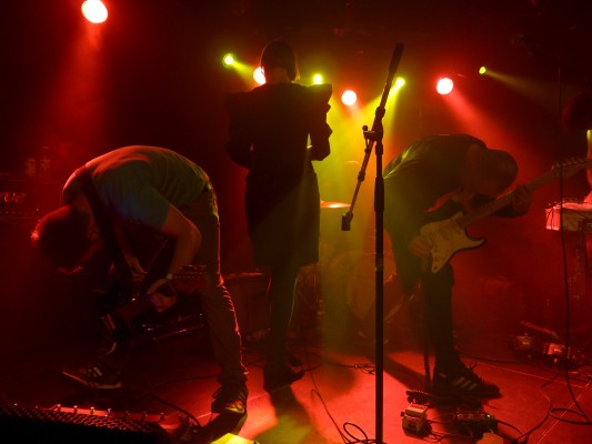 Johannes Gammelby on stage with band members